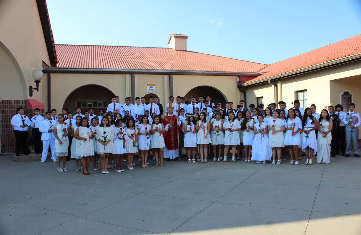 BOONVILLE — One hundred youths received the sacrament of confirmation at Divine Redeemer Church during a Mass offered June 9 by Bishop Peter Jugis. (Photos by Sergio Lopez)