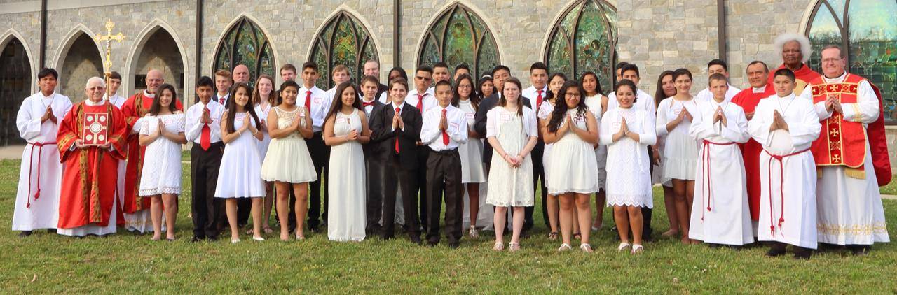 FOREST CITY — The sacrament of confirmation was conferred on 34 young people May 17 at Immaculate Conception Church by Monsignor Mauricio West, vicar general and chancellor of the Diocese of Charlotte. They are pictured with Monsignor West; Father Herbert