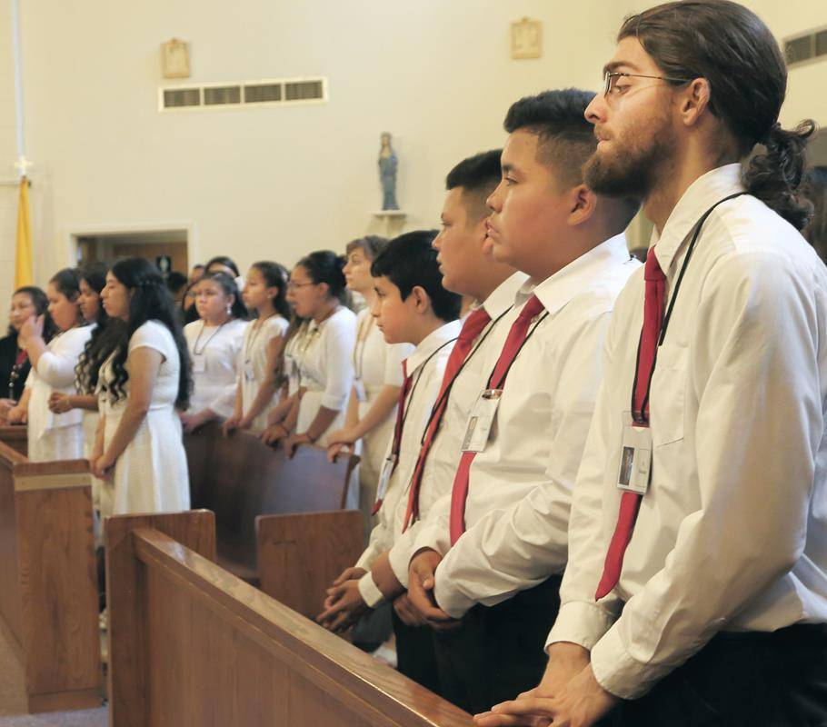 MARION — Thirteen young people at Our Lady of Angels Church in Marion were confirmed by Bishop Peter Jugis April 23 during a Spanish Mass concelebrated by Father Carl Kaltreider, pastor. the 1:00 PM Spanish Mass. Confirmandi were Alden Webster, Miguel San