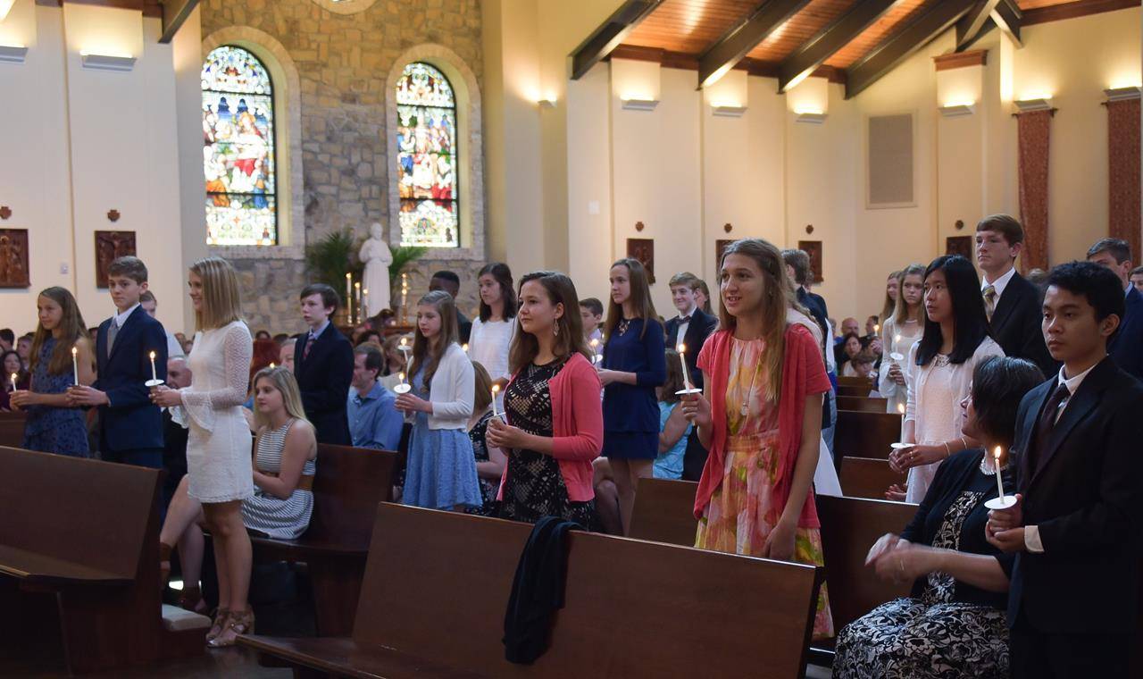 GREENSBORO — Youth at St. Pius X Church recently received the sacrament of confirmation, during Masses celebrated by Monsignor Anthony Marcaccio, pastor, and Monsignor Mauricio West, vicar general and chancellor of the Diocese of Charlotte. (Photos provid