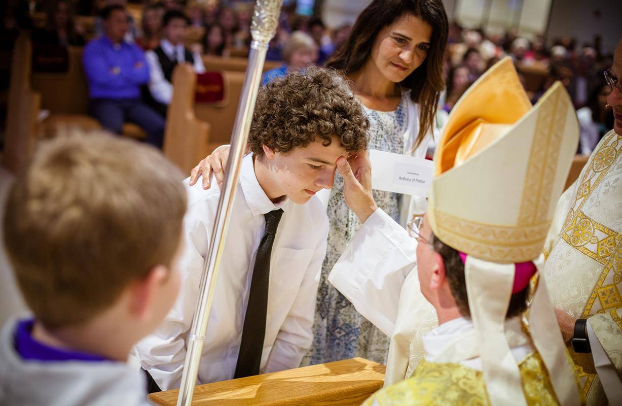 MOORESVILLE — Connor Anthony was recently among 158 young people confirmed during Masses April 19 and 21 at St. Thérèse Church by Bishop Peter Jugis. (Photo provided by Devinney Photography)