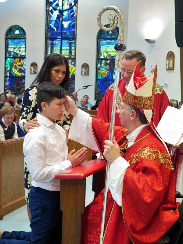 STATESVILLE — On May 3, Bishop Peter J. Jugis confirmed 31 young adults at St. Philip the Apostle Church in Statesville. (Photo provided by Connie Ries)