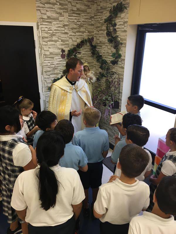 SALISBURY — Third grade teacher Mrs. Erin Brinkley turned a small corner of the classroom into a prayer retreat. Father John Eckert blessed the classroom grotto. (Photos provided by Robin Fisher)