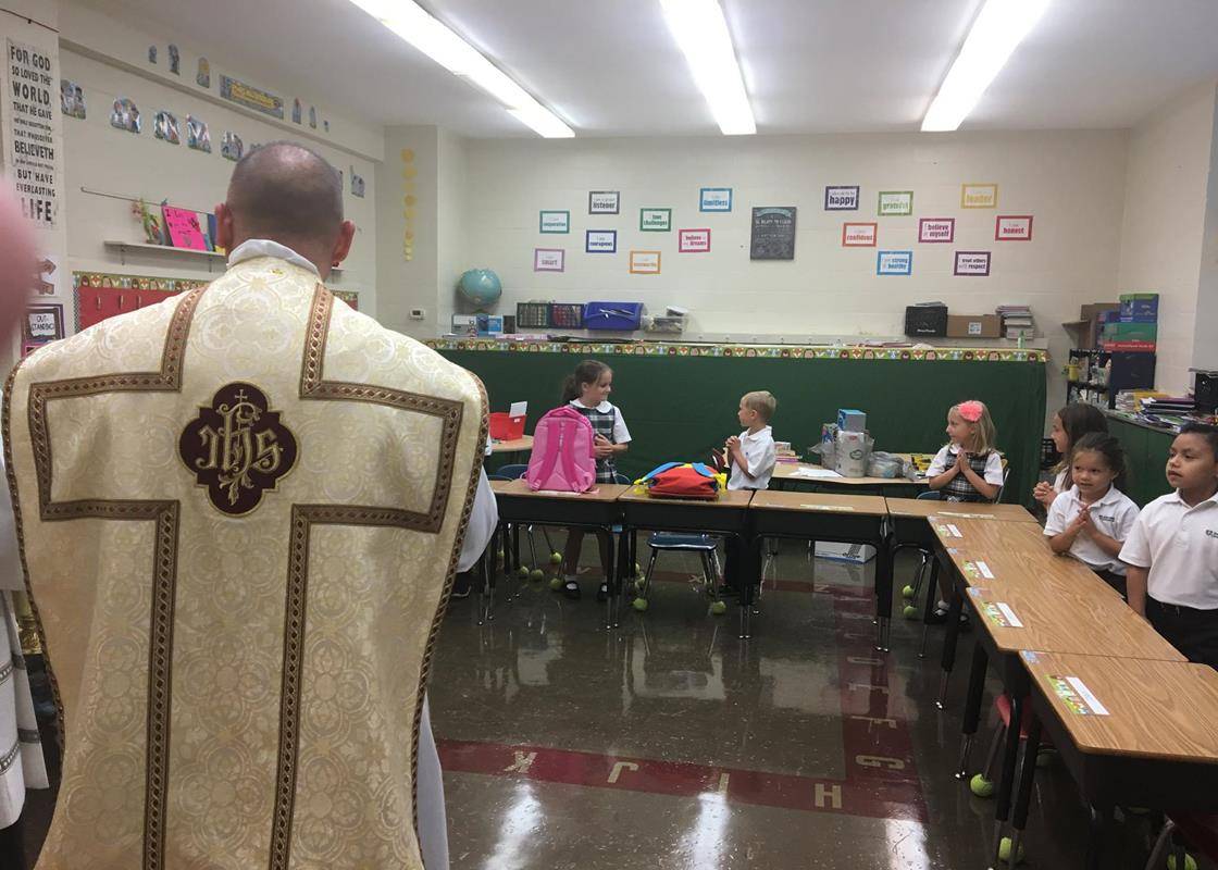 GASTONIA — The first week of school at St. Michael School ends with a blessing. Father Mat-thew Buettner blessed the hallways, classrooms and offices. (Photos via Facebook)