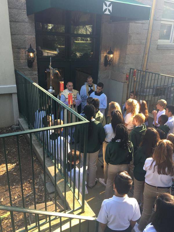 GASTONIA — The first week of school at St. Michael School ends with a blessing. Father Mat-thew Buettner blessed the hallways, classrooms and offices. (Photos via Facebook)