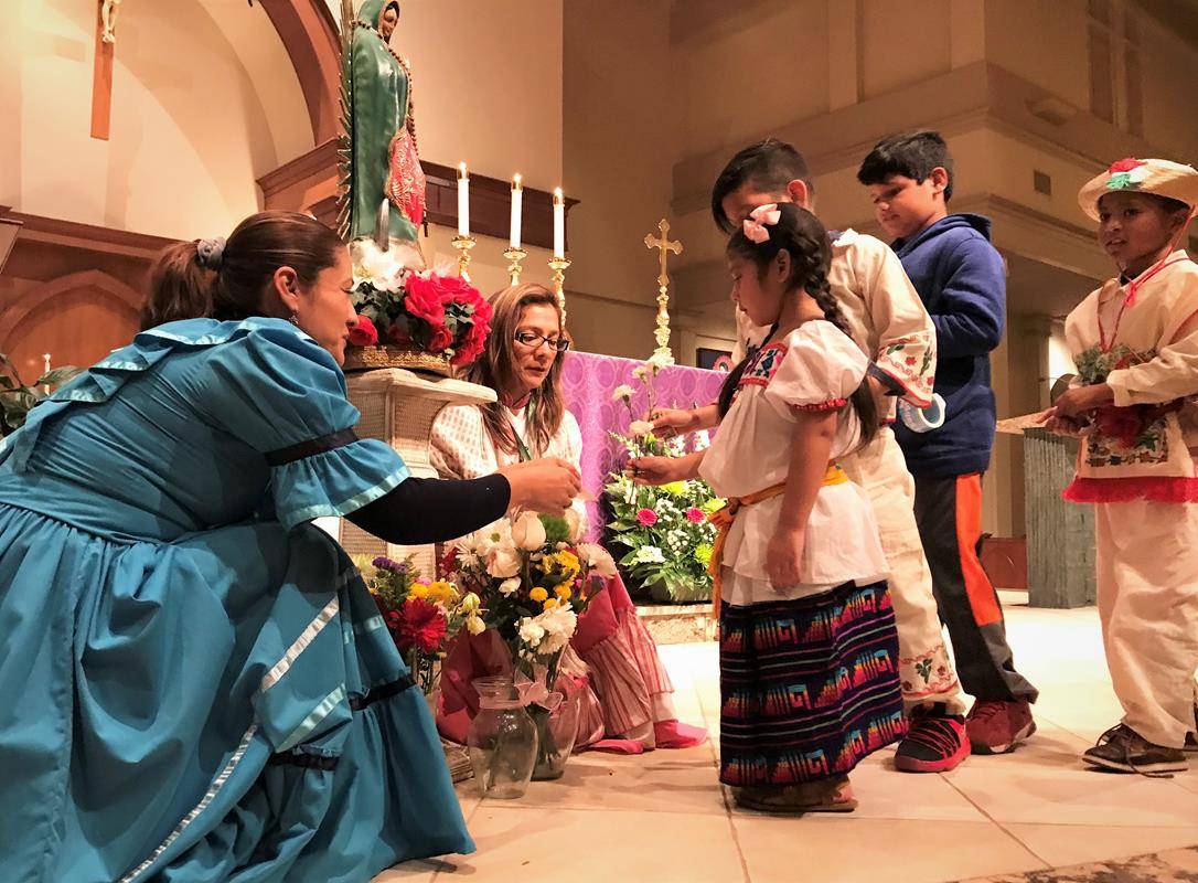 The Mass was bilingual offering a homily in Spanish from Father Gonzalez and then in English homily from Father Brian Becker. Immediately following the Mass was a large celebration in the Family Center. (Photos provided by Amy Burger)