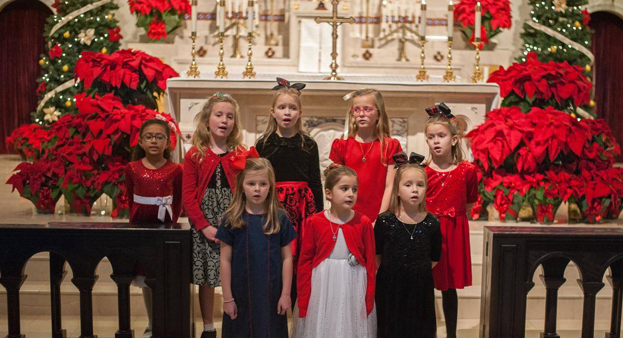 The children’s choir of Sacred Heart Church in Salisbury sang before Mass on Christmas Eve. (Bill Washington | Catholic News Herald)