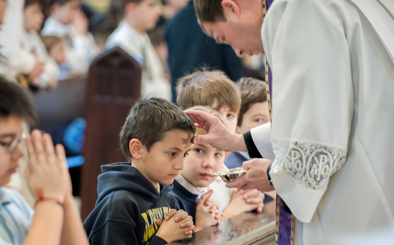 SALISBURY— Students at Sacred Heart School receive ashes during Mass on Ash Wednesday morning at Sacred Heart Church. (Bill Washington, Catholic News Herald)