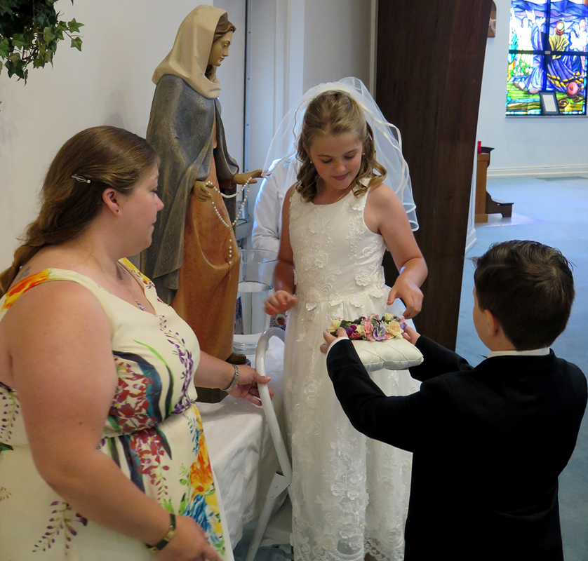 STATESVILLE — Children who received their first Holy Communion at St. Philip the Apostle Church participated in a May Crowning after both the English and the Spanish Masses earlier this month. (Photos provided by Connie Ries)