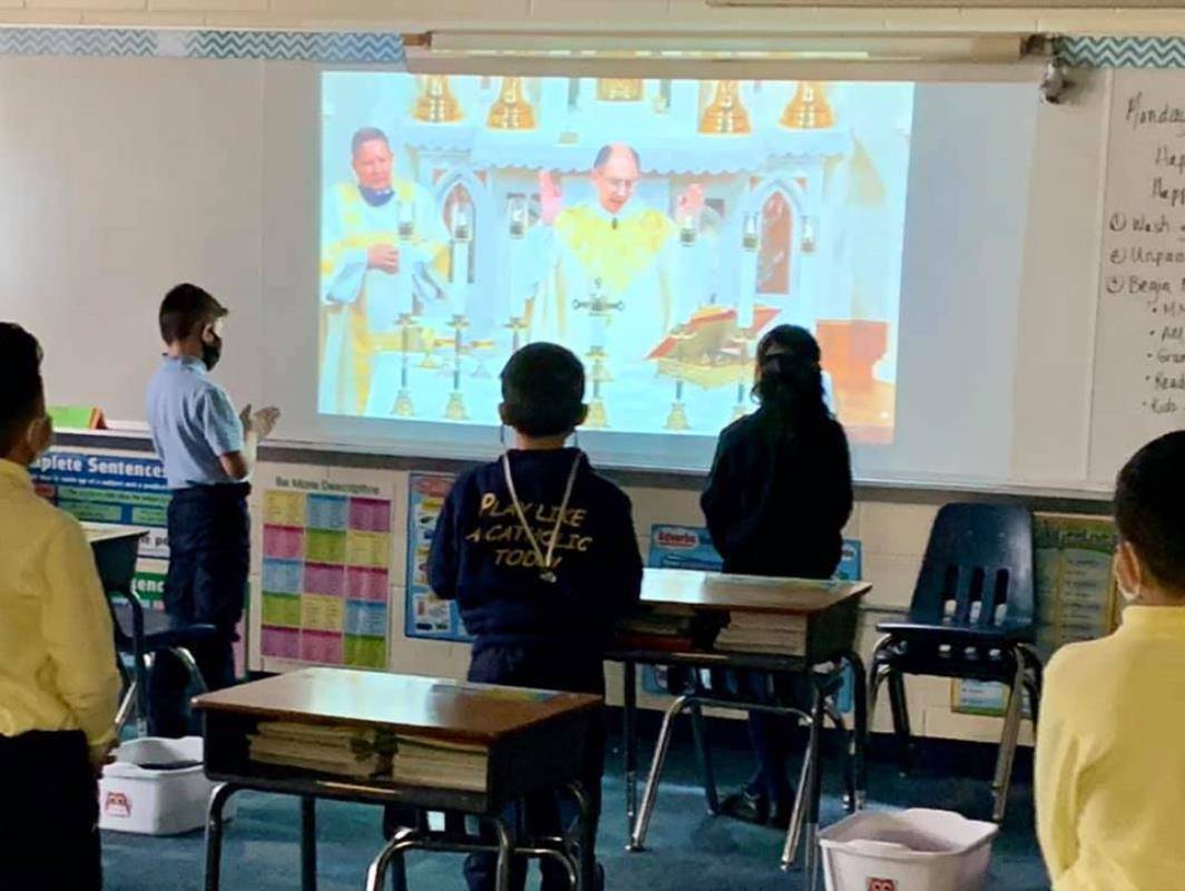 CHARLOTTE —Students at Our Lady of the Assumption School watched Bishop Peter Jugis celebrate Mass during a livestream for Catholic Schools Week. (Photo via Facebook)