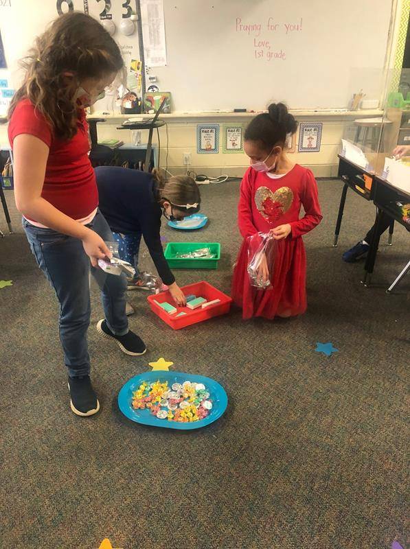 CHARLOTTE — In celebration of the theme service to others, St. Ann School students worked with their classmates to create blessing bags to donate to Merrywood, a local senior center. The students also wrote notes and drew pictures for residents.