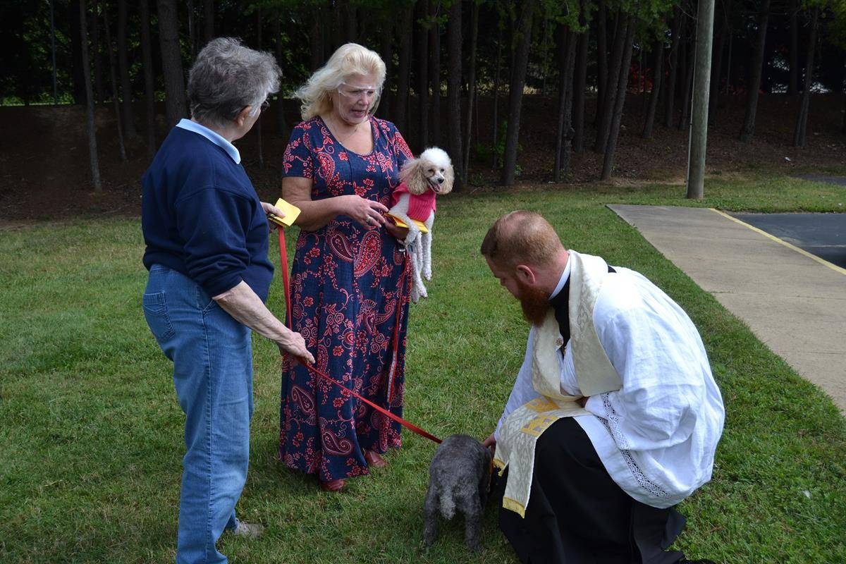Parishioners brought pets outside Holy Cross Church in Kernersville to be blessed. (Photos by Paul Doizé)
