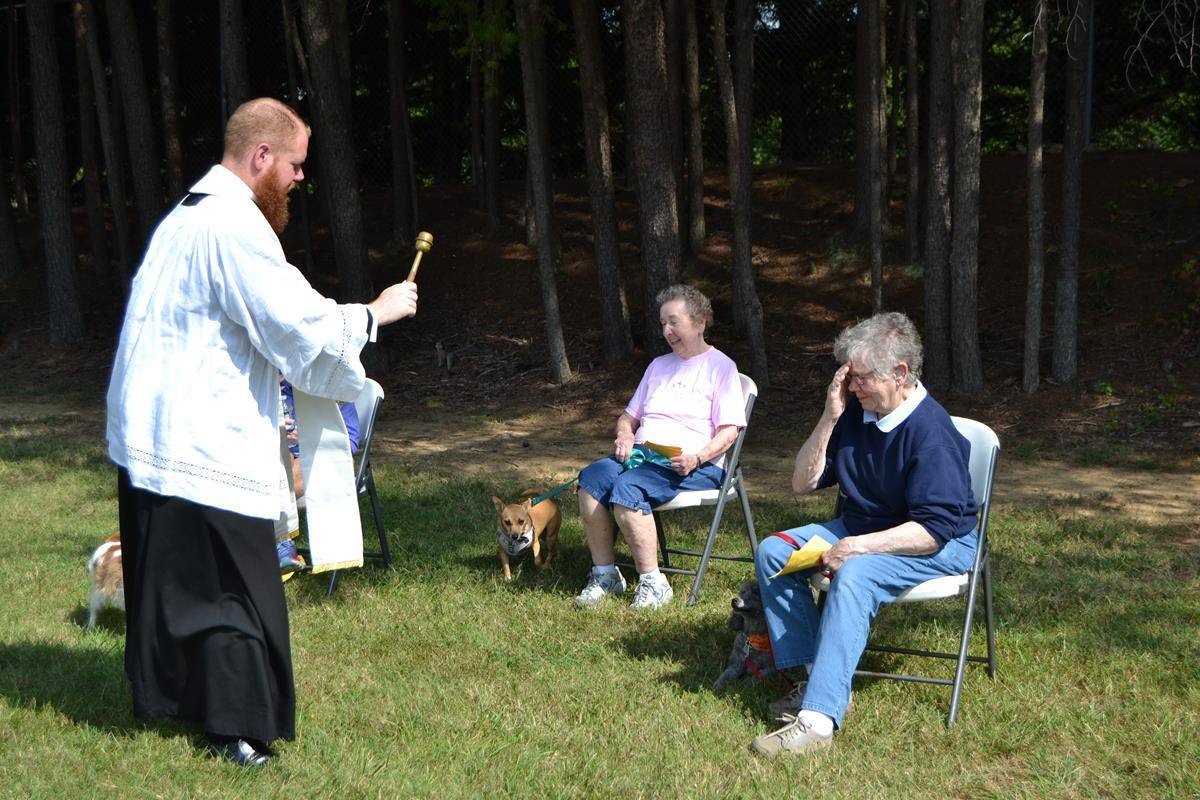 Parishioners brought pets outside Holy Cross Church in Kernersville to be blessed. (Photos by Paul Doizé)