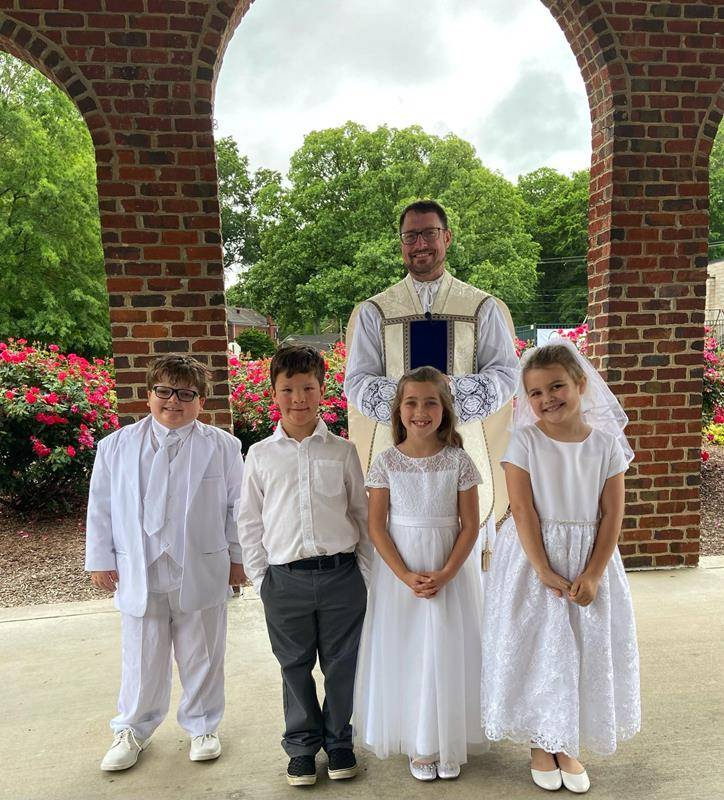Second grade students who recently received their First Communion were able to wear their attire.