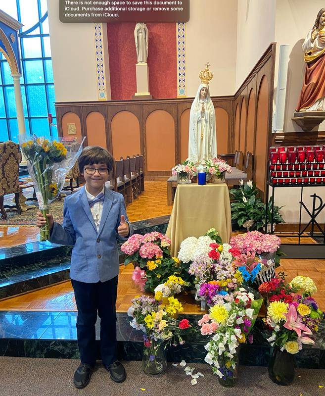 The entire student body went before Our Lady to place a flower to honor her constant grace in our lives. (Provided photos)