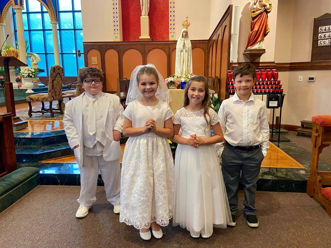 Second grade students who recently received their First Communion were able to wear their attire. (Provided photos)
