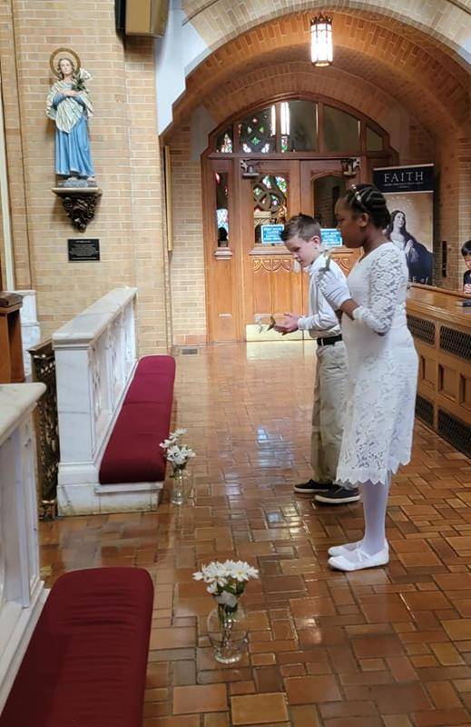 Our Lady of Grace celebrated its recent First Communicants with a May Crowning May 18. (Photos via Facebook)