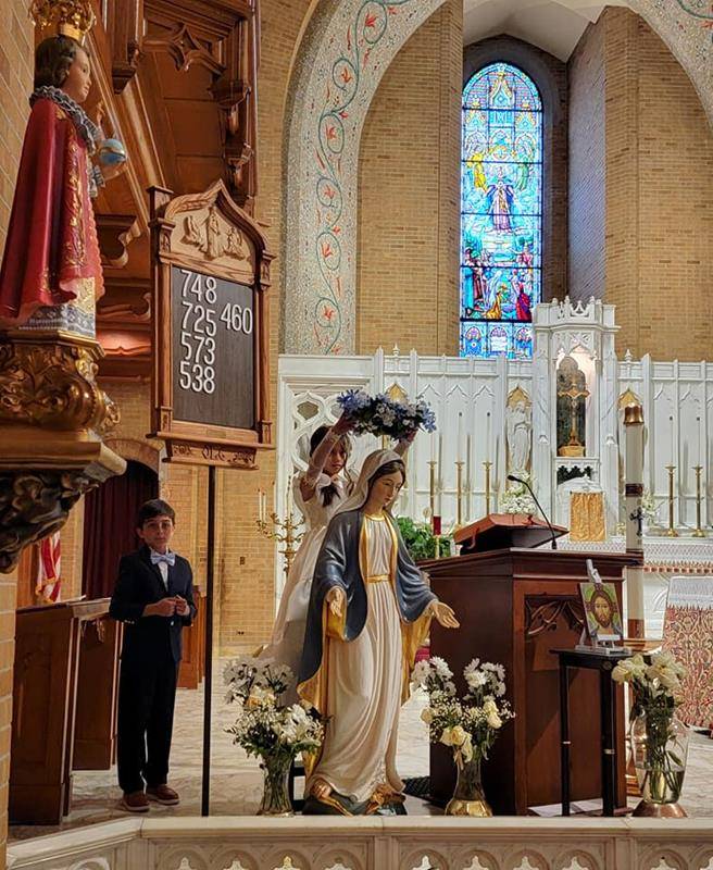Our Lady of Grace celebrated its recent First Communicants with a May Crowning May 18. (Photos via Facebook)