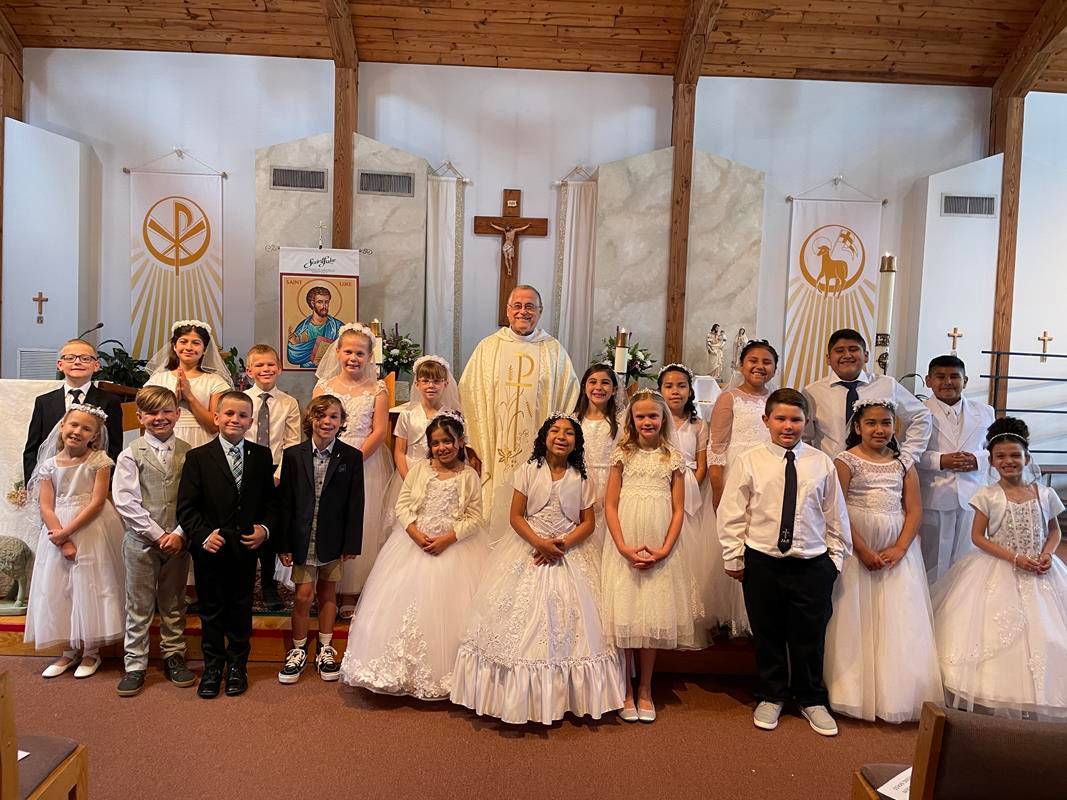 Thirty-nine children at St. Luke Parish in Mint Hill received their First Holy Communion during two Masses celebrated May 14 by Father Paul Gary, pastor. (Photos provided by Kathy McKinney)