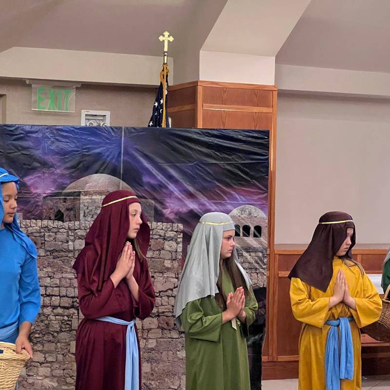 Fourth grade students at St. Matthew School performed live Stations of the Cross during Holy Week. (Provided photos)