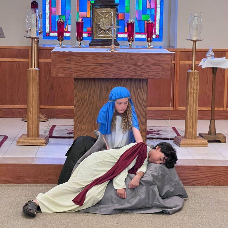 Fourth grade students at St. Matthew School performed live Stations of the Cross during Holy Week. (Provided photos)