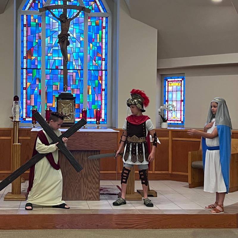 Fourth grade students at St. Matthew School performed live Stations of the Cross during Holy Week. (Provided photos)