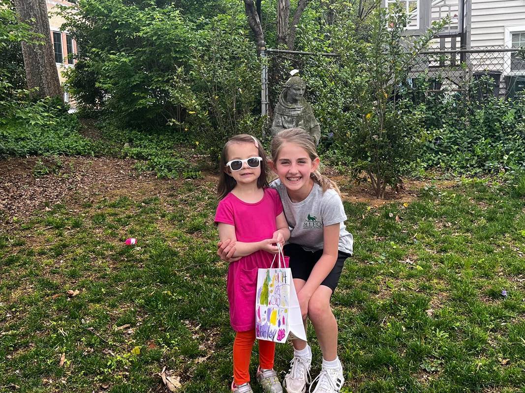 Fourth grade students at St. Leo School help their pre-k prayer partners hunt for Easter eggs. (Provided photos)