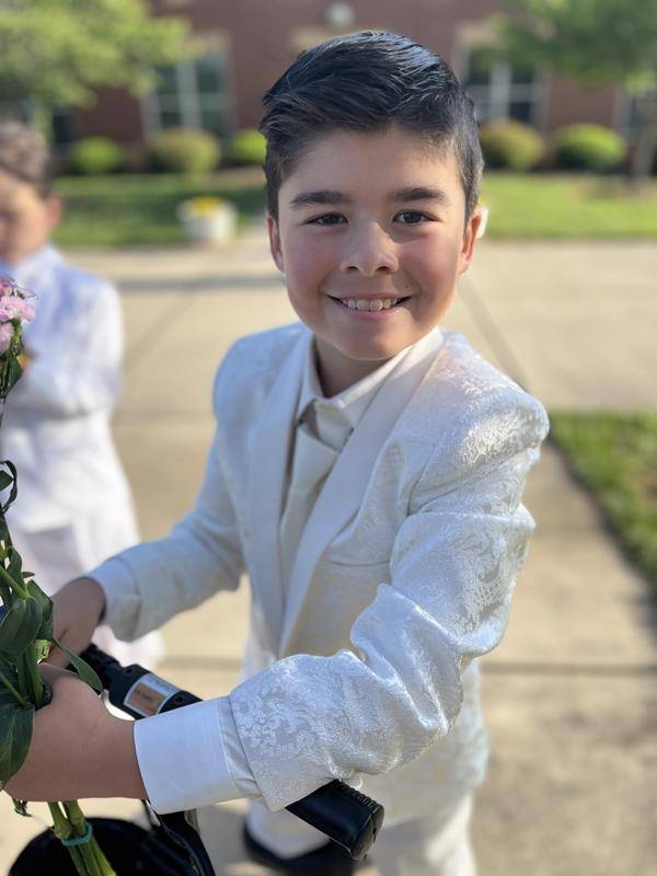 Second grade students at Sacred Heart School in Salisbury lead the all-school Mass and also adorned our Mother, Mary with flowers. (Provided photos)