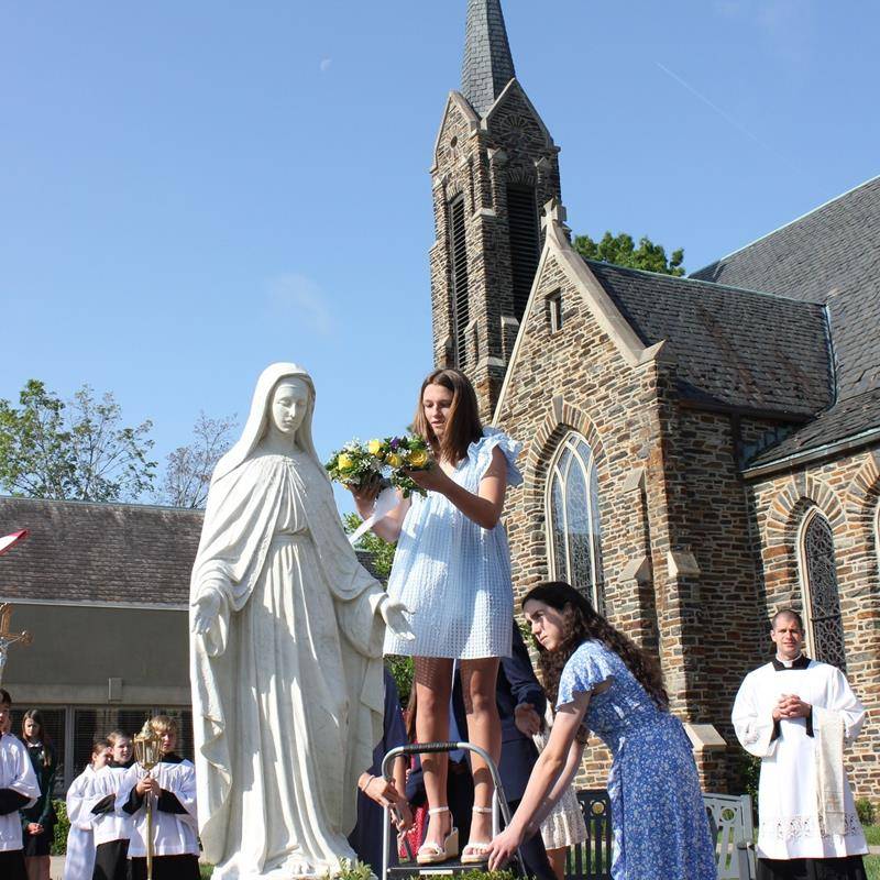 St. Leo School students crowned Mary, symbolic of Mary as Queen of Heaven and of our lives on May 12. (Provided photos)