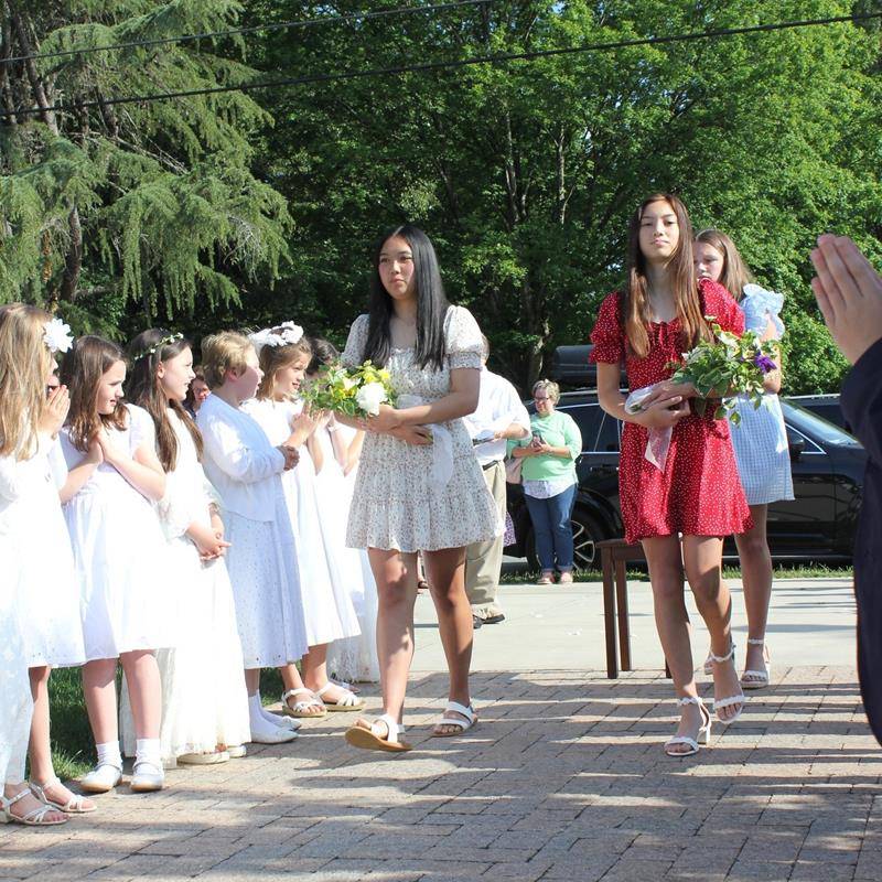 St. Leo School students crowned Mary, symbolic of Mary as Queen of Heaven and of our lives on May 12. (Provided photos)