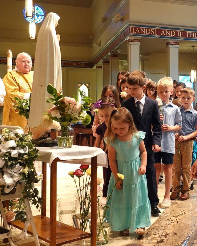Parishioners at St. Mark Church crown Mary on May 14. (Photos by Amy Burger)