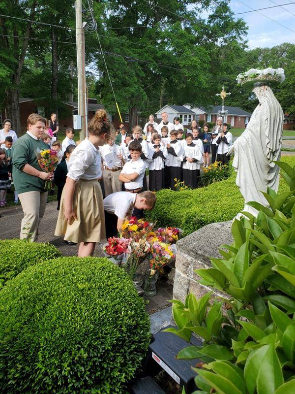 St. Michael School honored Mary with a May Crowning May 11. Saint Michael students sang a beautiful chorus to Mother Mary with verses of