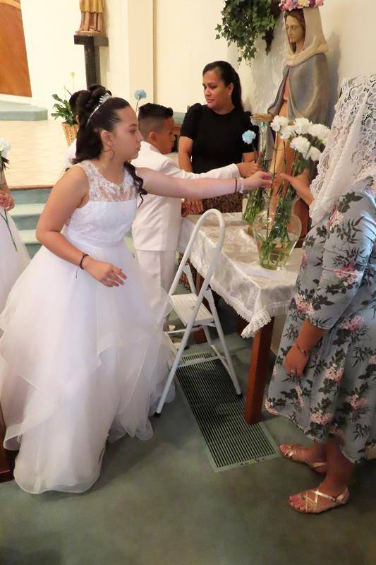 After First Communion the communicants participated in a the Crowning of the Blessed Virgin Mary at St. Philip the Apostle in Statesville. (Photos provided by Connie Ries)