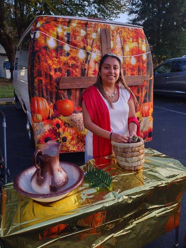 The evening included praying the rosary, a recounting of the miracle of Our Lady of Fatima, and interviews with saints followed by the trunk-or-treat activity where children visited parked cars decorated in saintly themes.