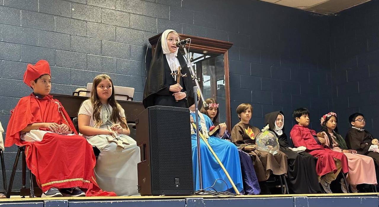 Fifth-grade students at Immaculata School dressed as saints and made presentations to all students during a special assembly.