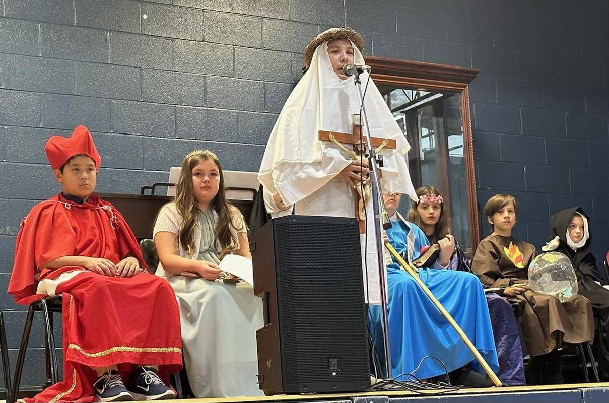 Fifth-grade students at Immaculata School dressed as saints and made presentations to all students during a special assembly.