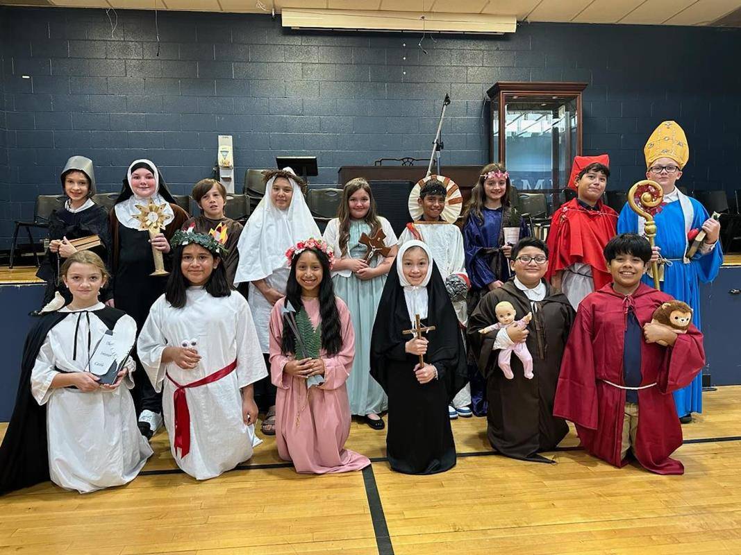 Fifth-grade students at Immaculata School dressed as saints and made presentations to all students during a special assembly.