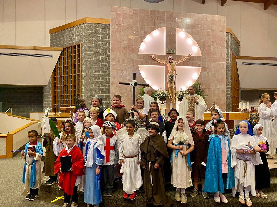 Second-grade saints at St. Matthew School dressed up for the school Mass.