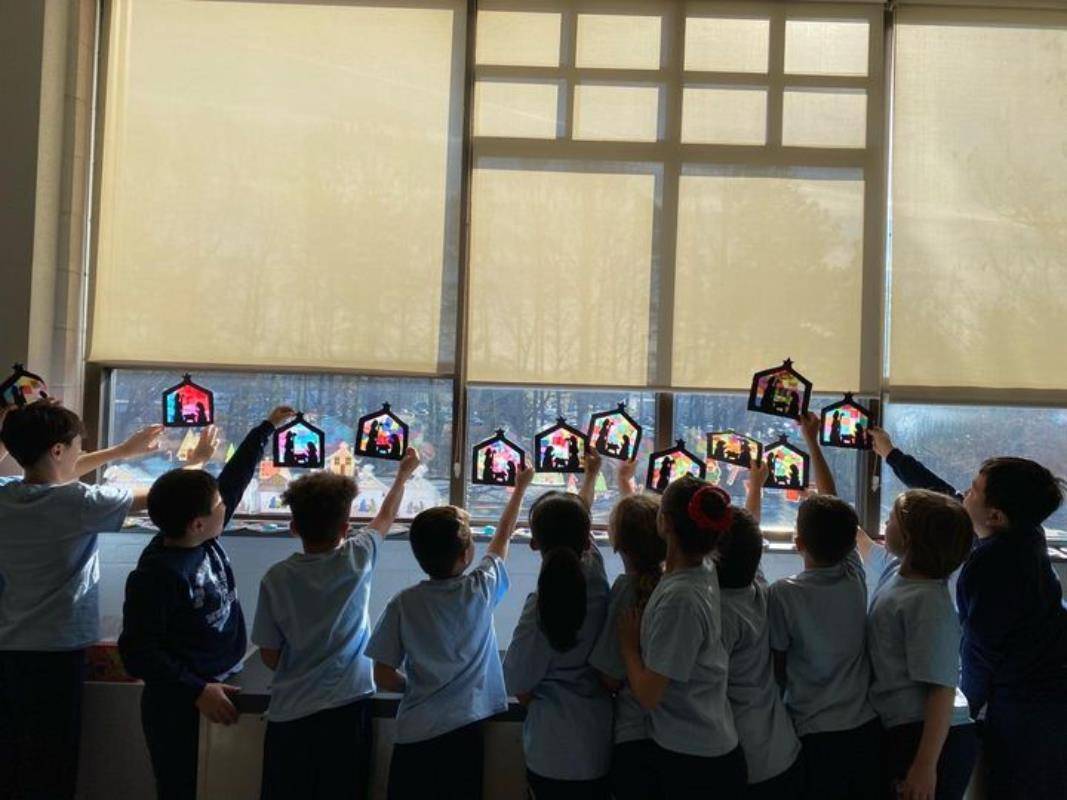Each Our Lady of Mercy School in Winston-Salem fourth-grade student made a stained-glass nativity to celebrate Christmas.