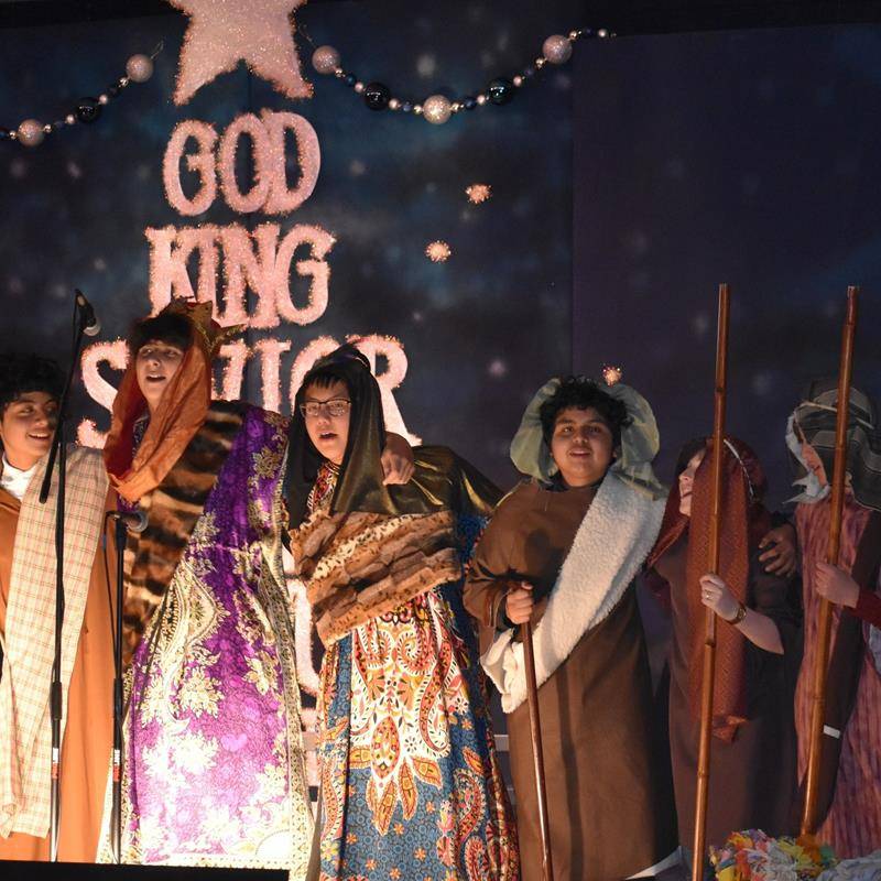 Our Lady of Mercy School’s eighth-grade class recently led a singalong of their favorite Christmas carols.ols.(2)