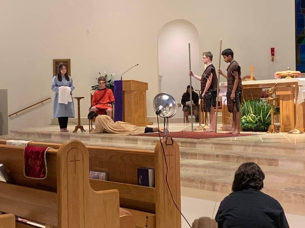 Youth ministry at St. Therese Church in Mooresville recreate living Stations of the Cross.