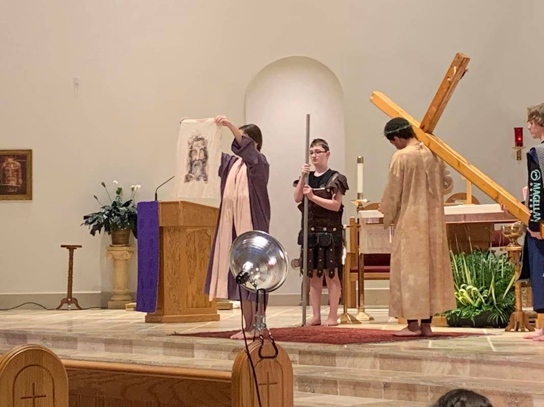 Youth ministry at St. Therese Church in Mooresville recreate living Stations of the Cross.