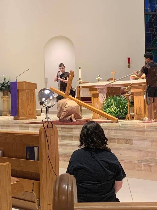 Youth ministry at St. Therese Church in Mooresville recreate living Stations of the Cross.