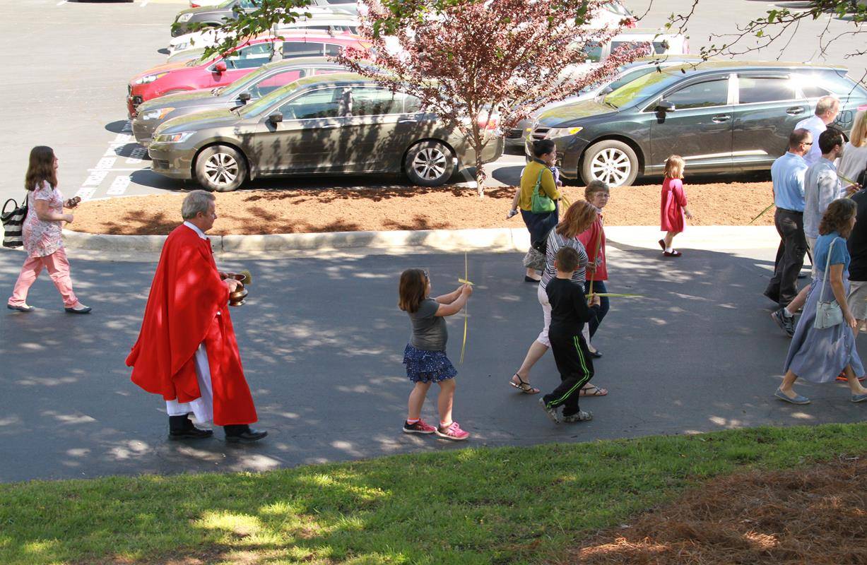 Palm Sunday Mass at Holy Cross Church in Kernersville. (By John Bunyea)