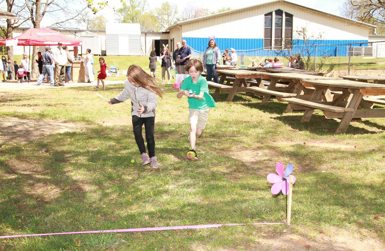 Erin Muranane and Marshall Davis compete in Holy Cross Church's egg race (Photo by John Bunyea)
