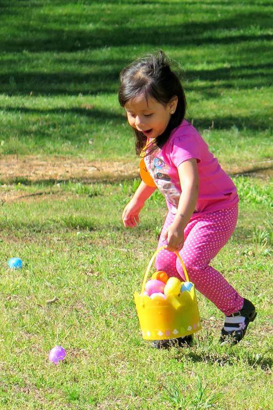Finding eggs in the Easter egg hunt at St. Philip Church in Statesville (Photo by Connie Ries)