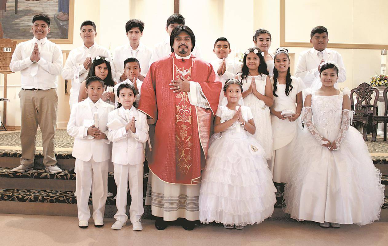 BOONVILLE — Divine Redeemer Church was filled with joy June 3-4 as 123 children received their first Holy Communion during four Masses. — Photos by Sergio Lopez | Catholic News Herald