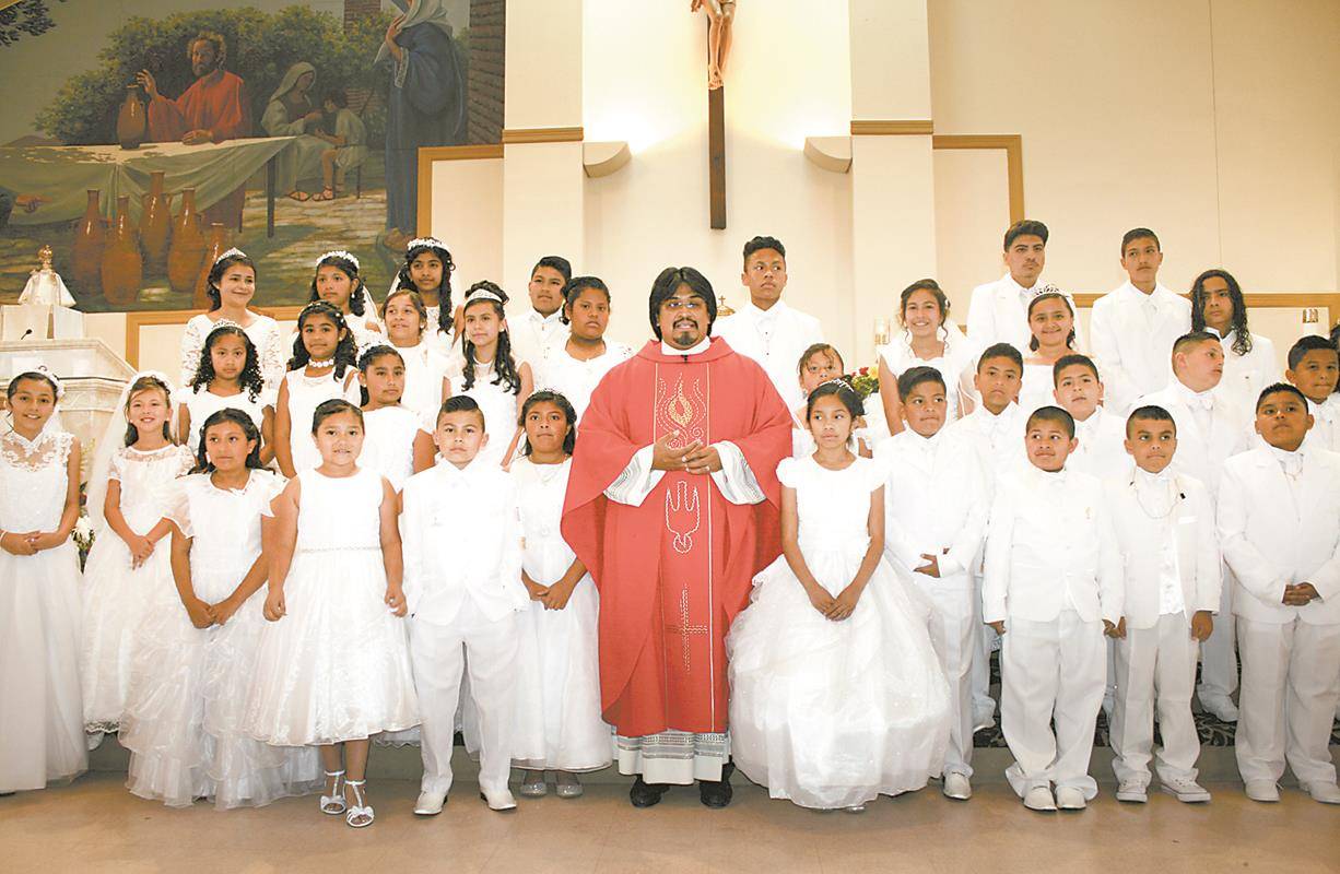 BOONVILLE — Divine Redeemer Church was filled with joy June 3-4 as 123 children received their first Holy Communion during four Masses. — Photos by Sergio Lopez | Catholic News Herald