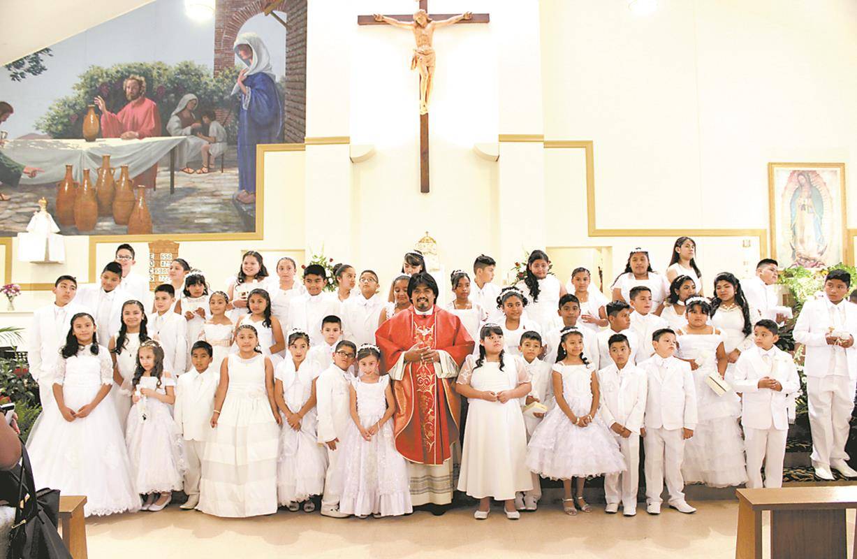 BOONVILLE — Divine Redeemer Church was filled with joy June 3-4 as 123 children received their first Holy Communion during four Masses. — Photos by Sergio Lopez | Catholic News Herald