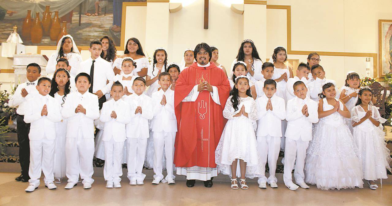 BOONVILLE — Divine Redeemer Church was filled with joy June 3-4 as 123 children received their first Holy Communion during four Masses. — Photos by Sergio Lopez | Catholic News Herald